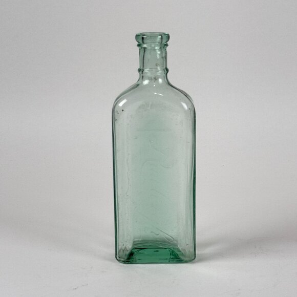 Antique Raulieghs Pale Green Glass Bottle With Raised Lettering - Picture 1 of 8